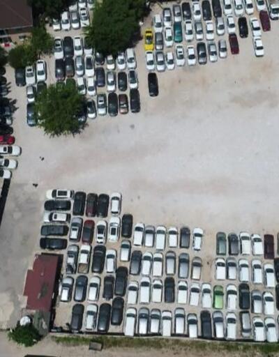 Milyonluk hacizli araçlar otoparkta çürüyor | Video