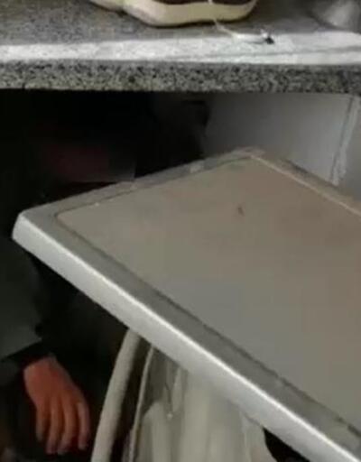 Çamaşır makinesinin arkasına saklanan göçmen yakalandı