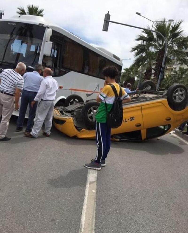 İzmir'de takla atan taksi ters döndü, sürücü yaralandı